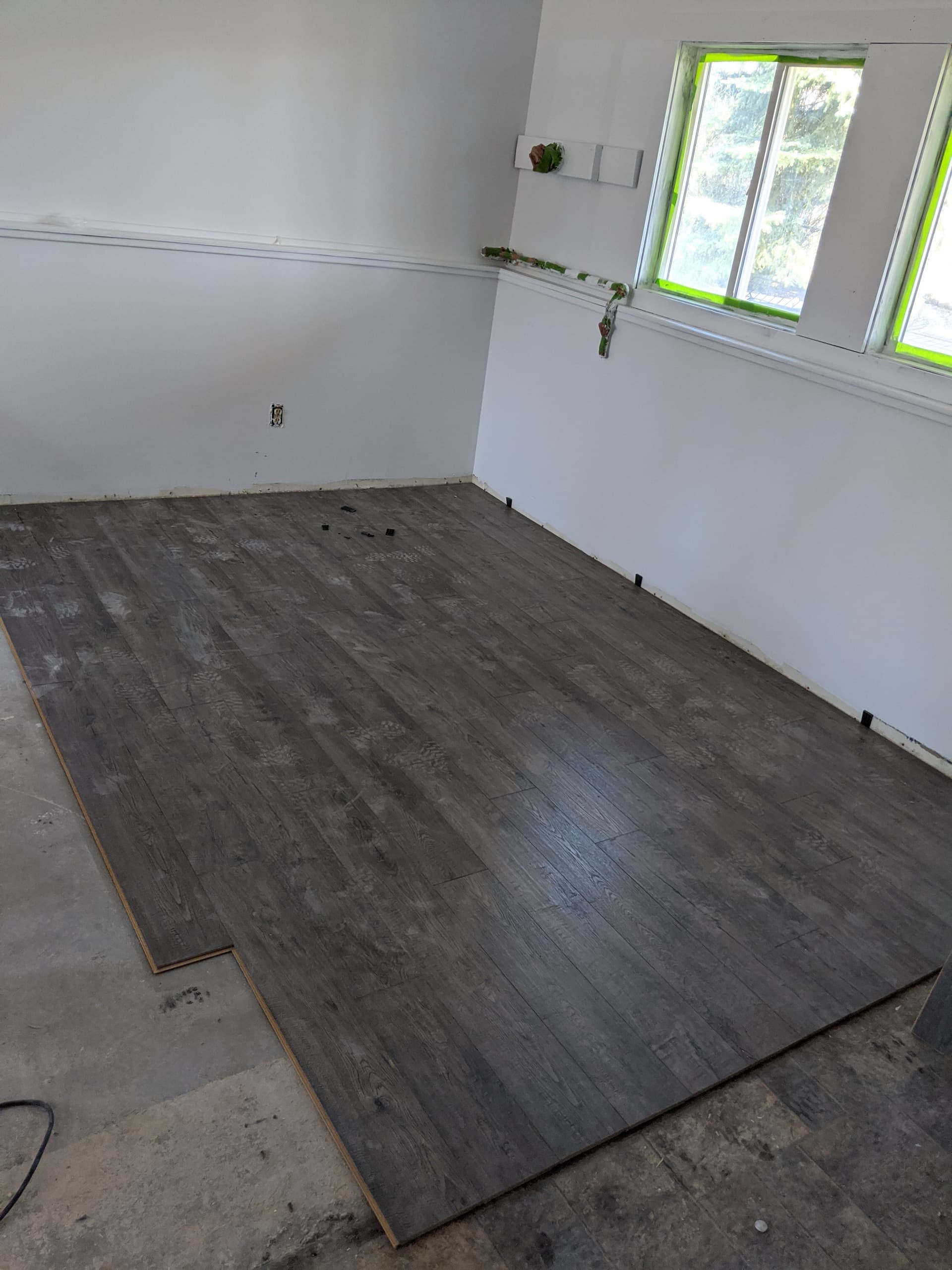 Laying new flooring in the Bozeman duplex