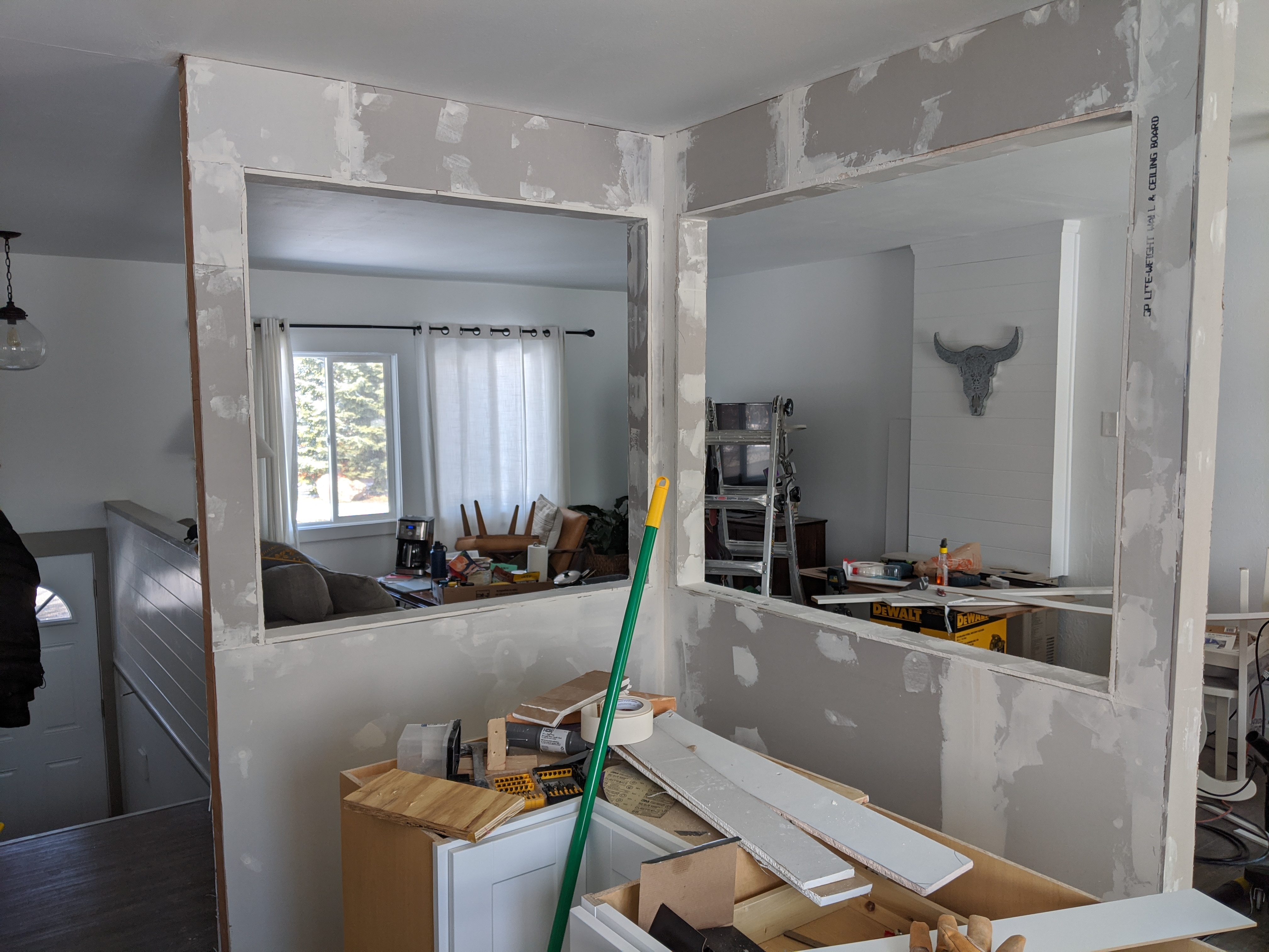Drywall installation during Bozeman duplex renovation