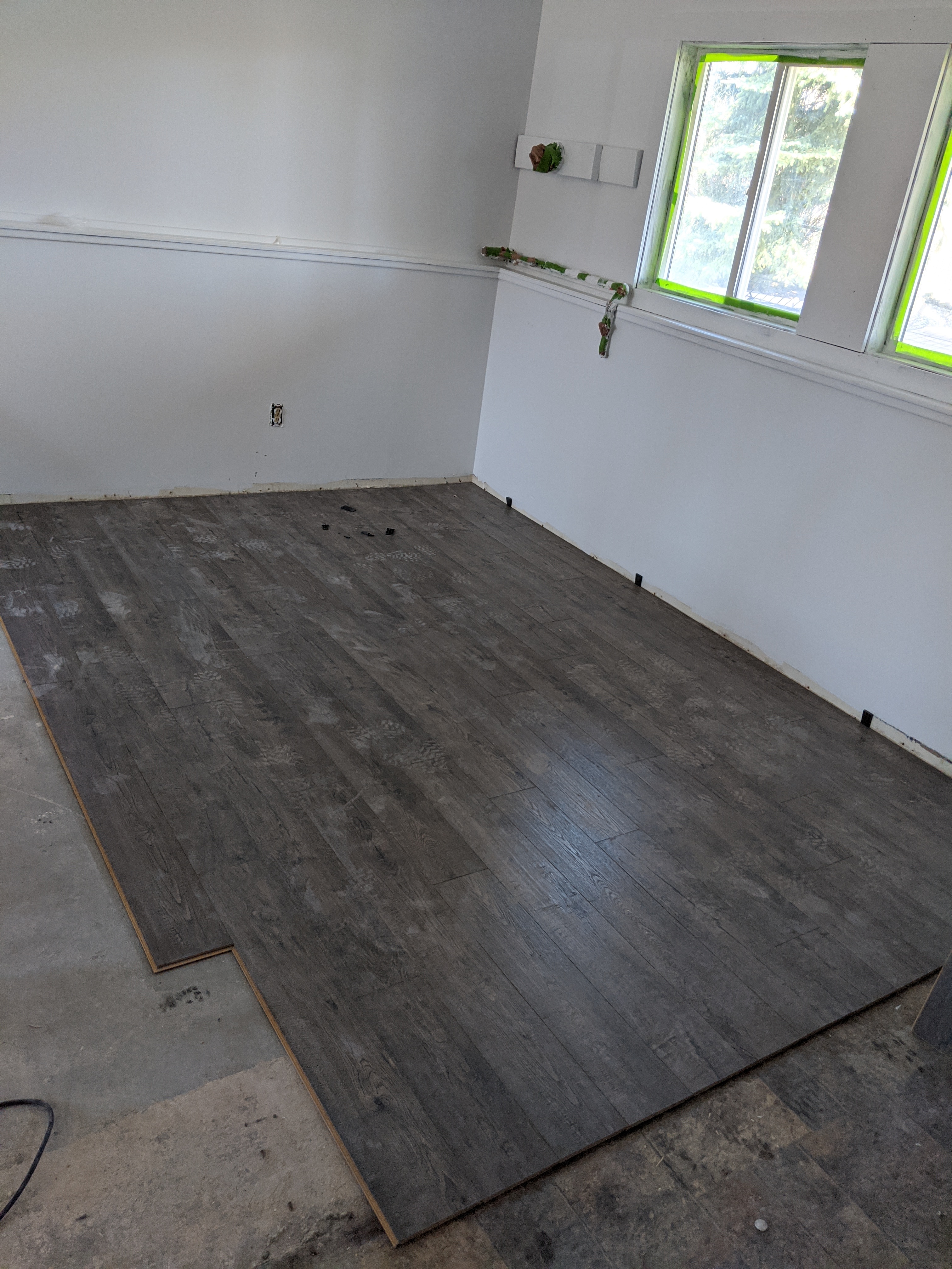 Laying new flooring in the Bozeman duplex